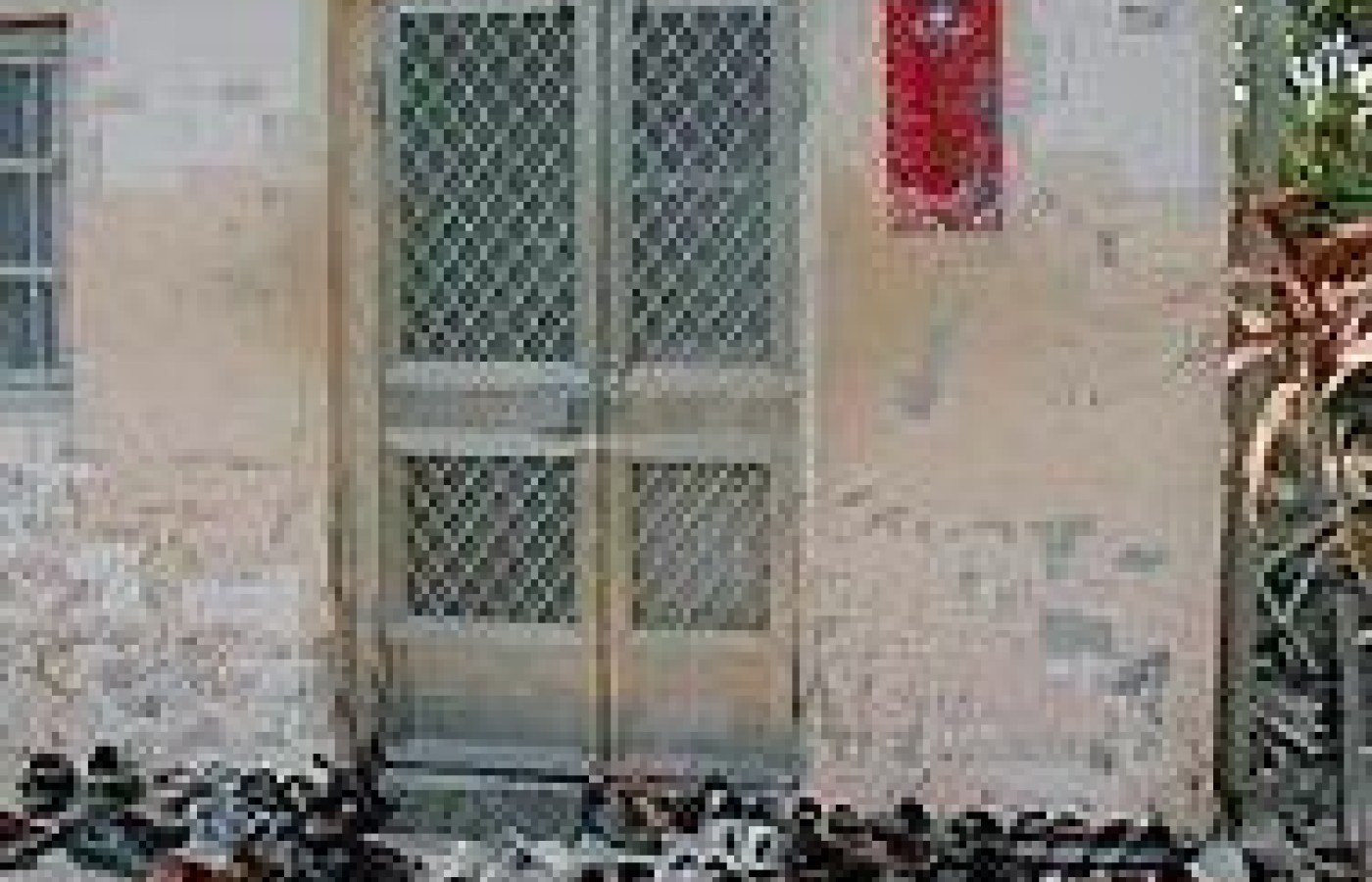 Patients' shoes piled outside the door to Dr. Fuda's clinic.