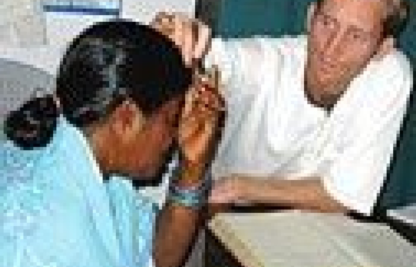 Brett Bloomberg conducts a patient intake at Ananda Nagar.